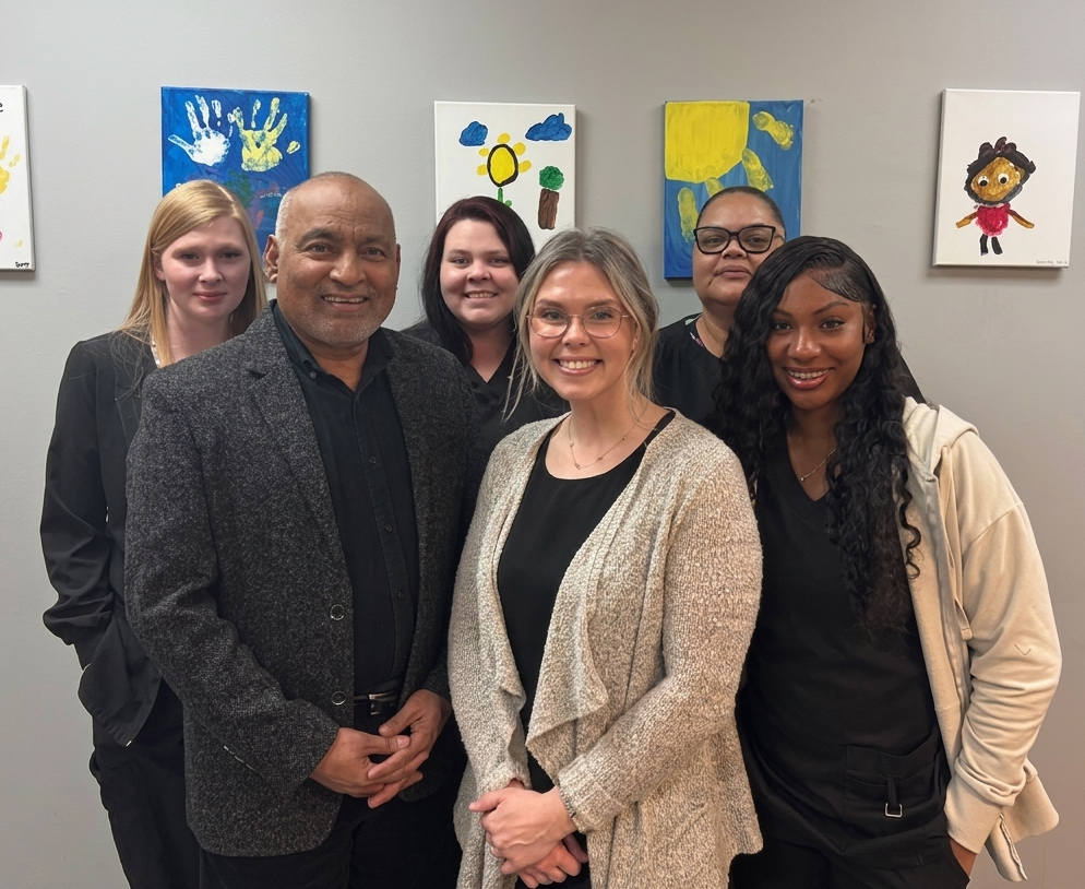 The Pediatric Consultants of Cedar Bluff team smiling together in the office